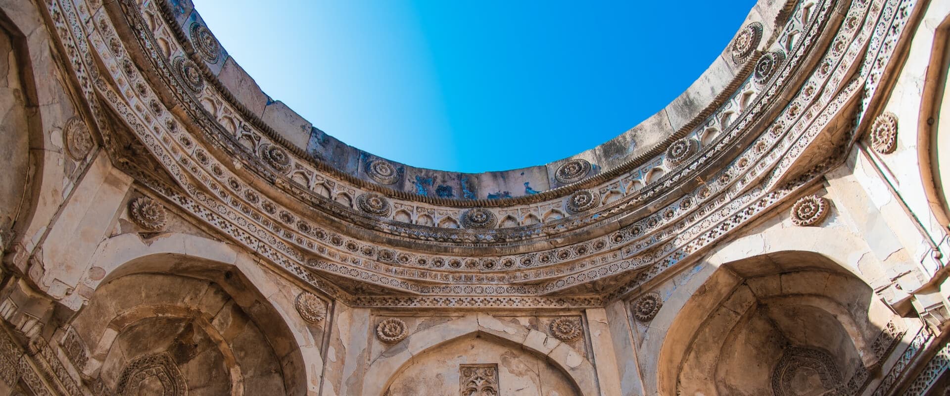 Blue sky above an old building.